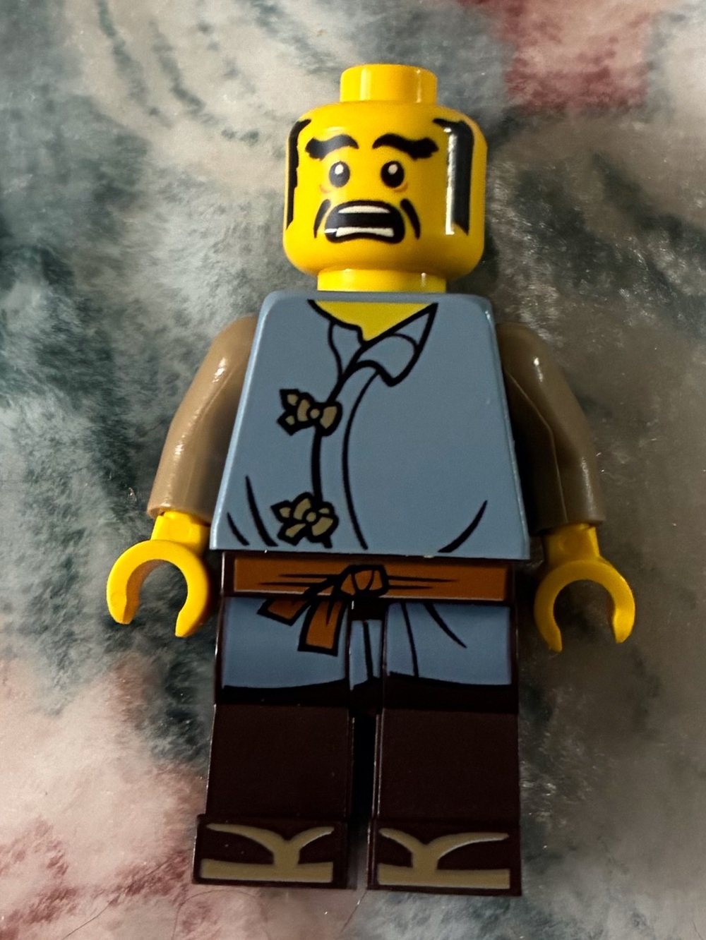 Lego Yellow-Headed Minifigure with Light Blue Torso and Brown Legs